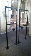 The freestanding frames for St Sebastian and Priest fixed into the gallery