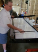 Neil showing us how the LED panel for St Anthony fits in the frame